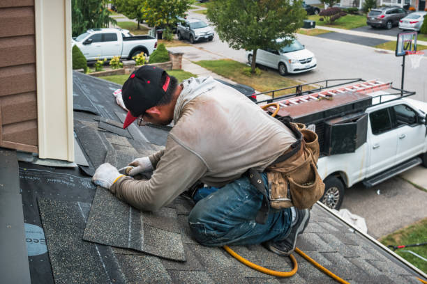 Professional Gutter Repair And Installation technician working in Marengo, IA